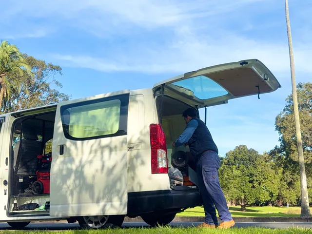 Unloading the All City Services van at a job site